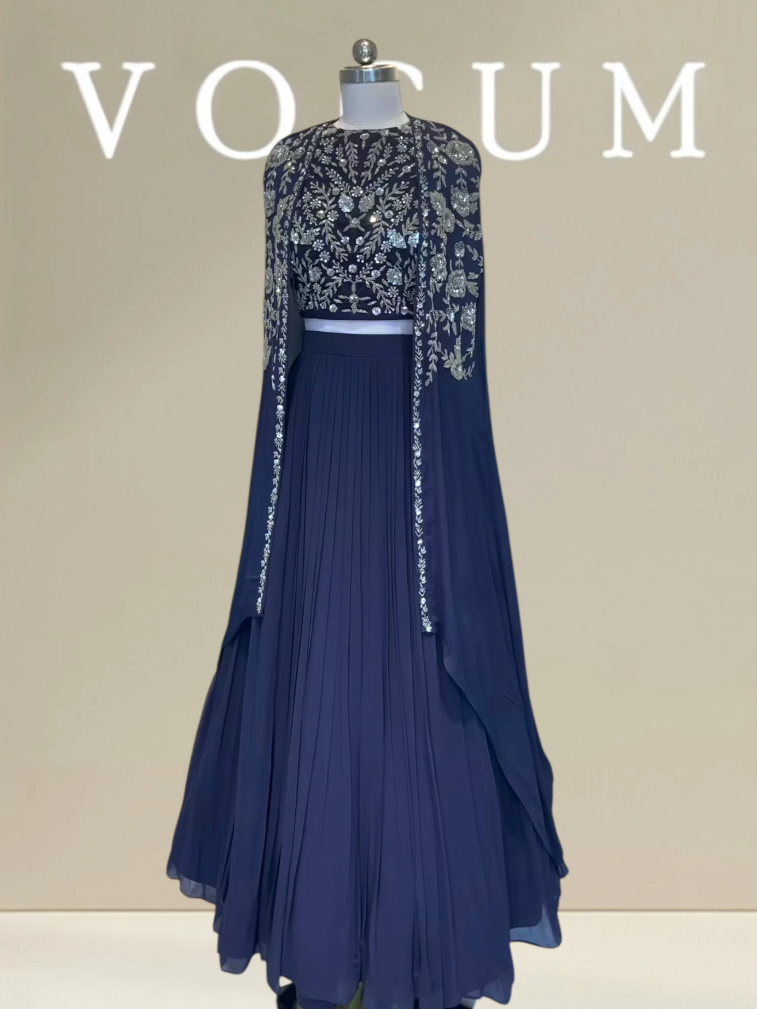 Pleated skirt with flowy cape related product